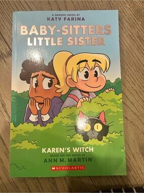 Scholastic Graphic Novel with Blue and Green Cover Art
